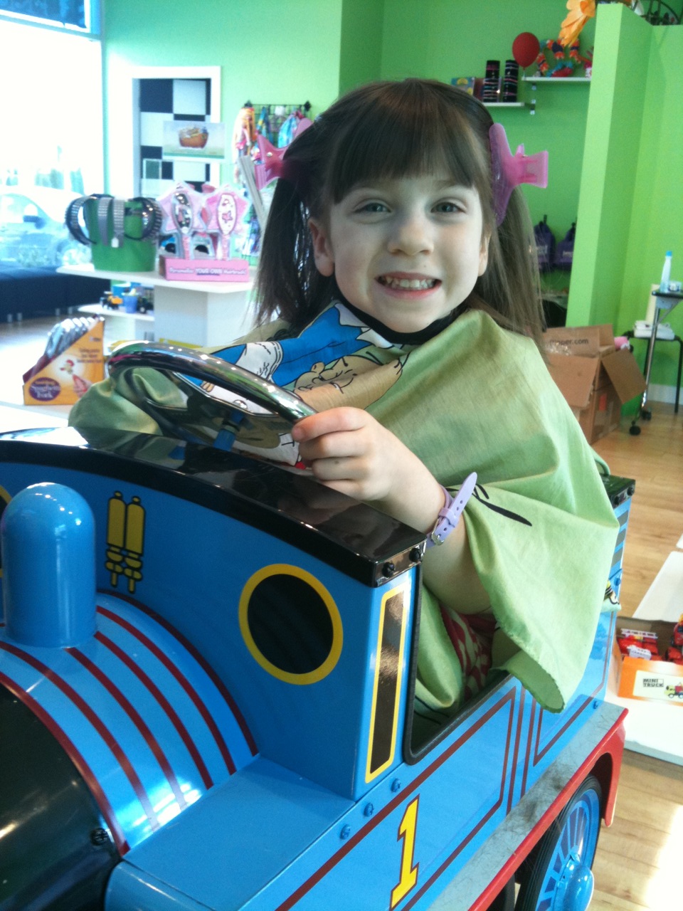 Sierra enjoying the Thomas seat for her hair cut